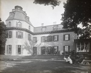 People Seated in Chairs on the Lawn in Front of the Astor Chanler Residence at Barrytown, New York by Byron Company